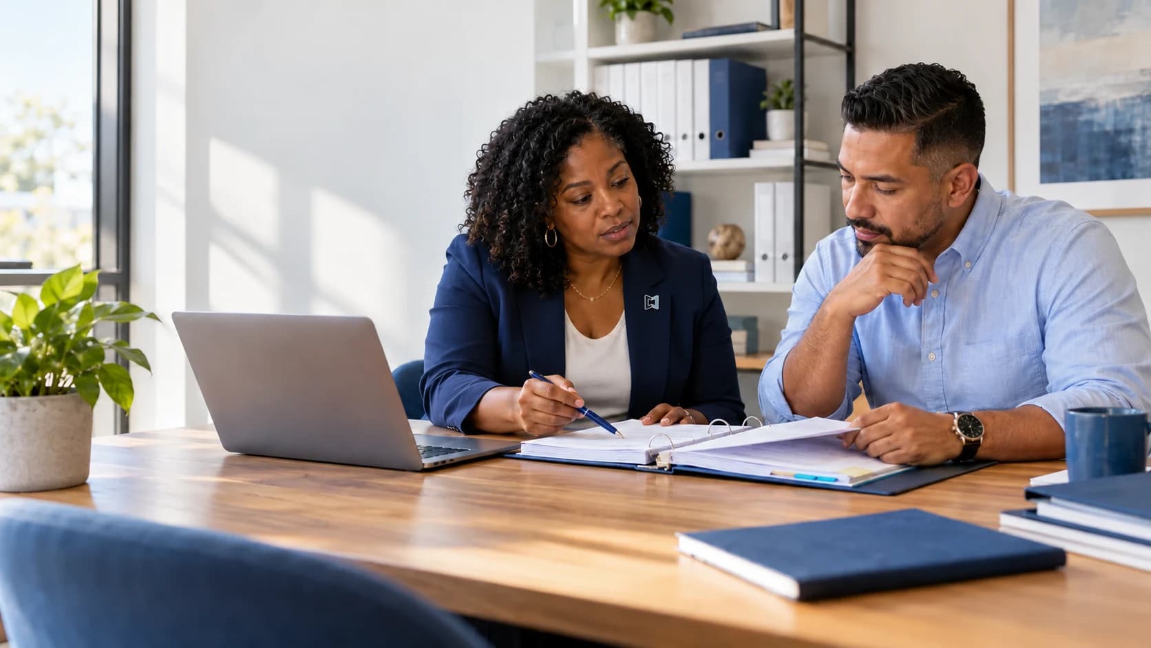 Two agency leaders reviewing a policy manual